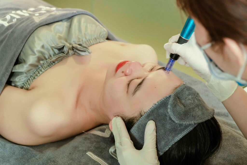 Woman receiving a relaxing facial treatment at a professional beauty spa in Vietnam.